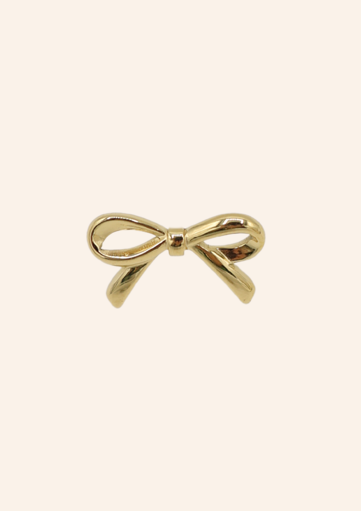 Gouden broche in de vorm van een strikje