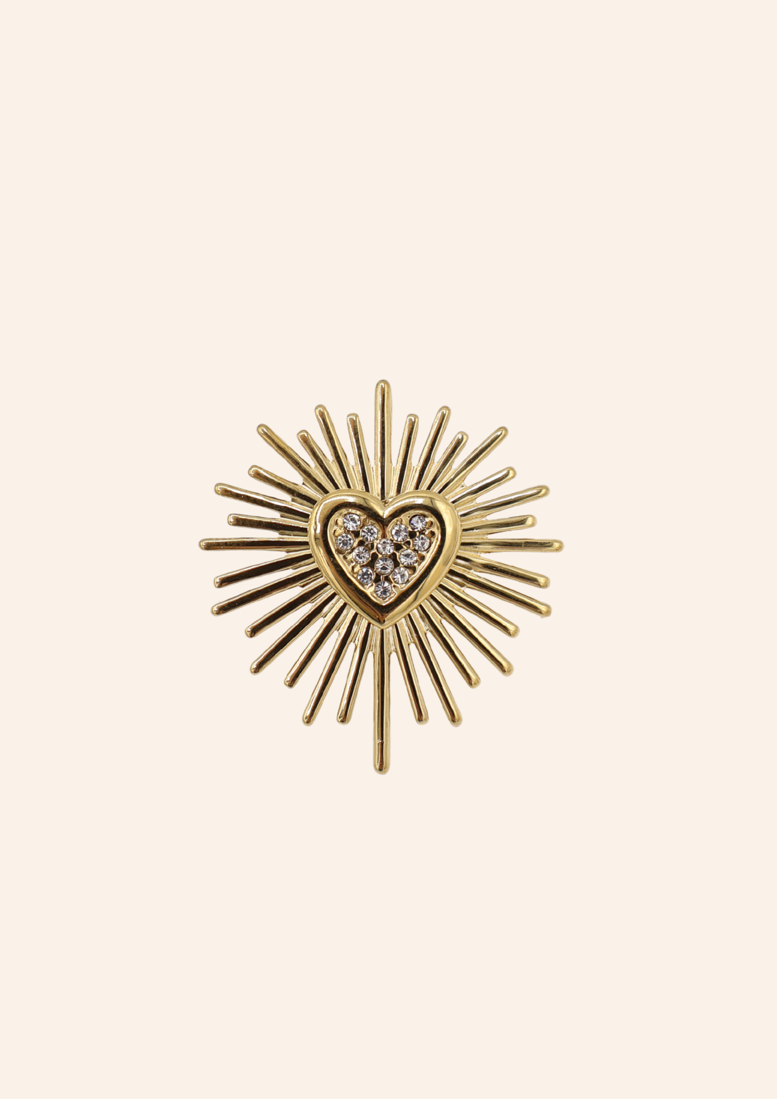 Gouden broche in de vorm van een hartje. Gemaakt van stainless steel
